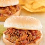Homemade sloppy joe sandwich on parchment paper.