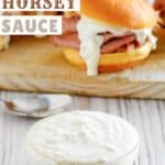 A small bowl of homemade Arby's horsey sauce and roast beef sandwiches behind it.