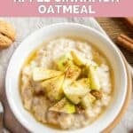 A bowl of oatmeal topped with chopped apples and ground cinnamon.