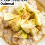 A bowl of oatmeal topped with cinnamon and apples.