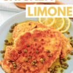 Homemade Buca de Beppo chicken limone and lemon slices on a plate.