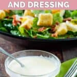 A bowl of copycat Commander's Palace salad dressing in front of a salad.