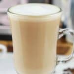 A homemade Starbucks flat white coffee drink in a glass mug.