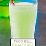 Homemade Taco Bell baja blast freeze drink with a straw on a table.