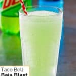 Homemade Taco Bell baja blast freeze in a glass on a table.