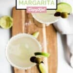 Homemade Applebee's perfect margarita on a small wood board.