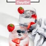 Two glasses of berry infused water with fresh berries in them.
