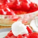 A slice of homemade big boy strawberry pie on a dessert plate.