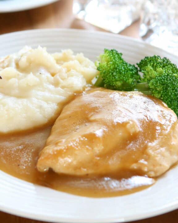 Roasted chicken breast with homemade chicken gravy.