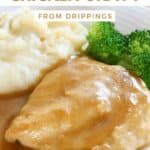Homemade chicken gravy over a baked chicken breast.