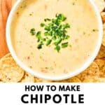 A bowl of homemade Chipotle queso blanco and tortilla chips on a wood serving board.