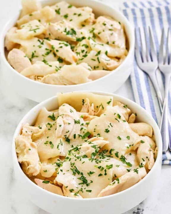 Copycat Cracker Barrel chicken and dumplings in two bowls.