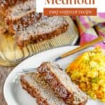 Copycat Cracker Barrel meatloaf on a wood board and slices on a plate.