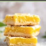 Three homemade classic lemon bars in a stack.
