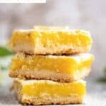 Three classic lemon bars in a stack.