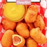 Homemade mini corn dogs and a small cup of mustard in a serving basket.