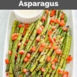 Homemade olive garden parmesan roasted asparagus on a rectangular platter.