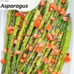 Homemade olive garden parmesan roasted asparagus garnished with hopped tomatoes.