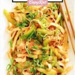 Copycat Panda Express chow mein and chopsticks on a rectangular platter.