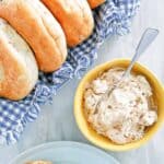 Copycat Panera honey walnut cream cheese in a bowl and spread on a bagel.