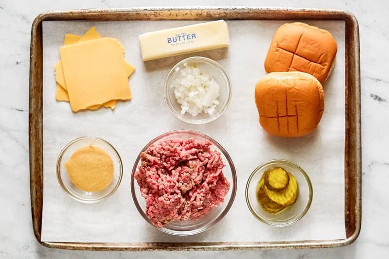 Copycat double sonic smasher burger ingredients on a tray.