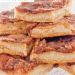 Homemade sopapilla cheesecake bars on a glass platter.