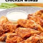 Homemade Wingstop Louisiana rub wings and a cup of ranch dressing on a plate.