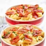 Two bowls of Applebee's 4 cheese mac and cheese with bacon on top.