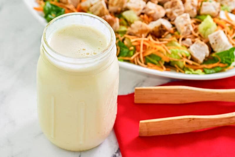 Copycat Applebee's oriental salad dressing in a jar and a chicken salad.