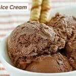 Several scoops of homemade Ben & Jerry's chocolate ice cream in a bowl.