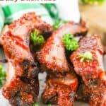 Six homemade Chili's baby back ribs on a plate.