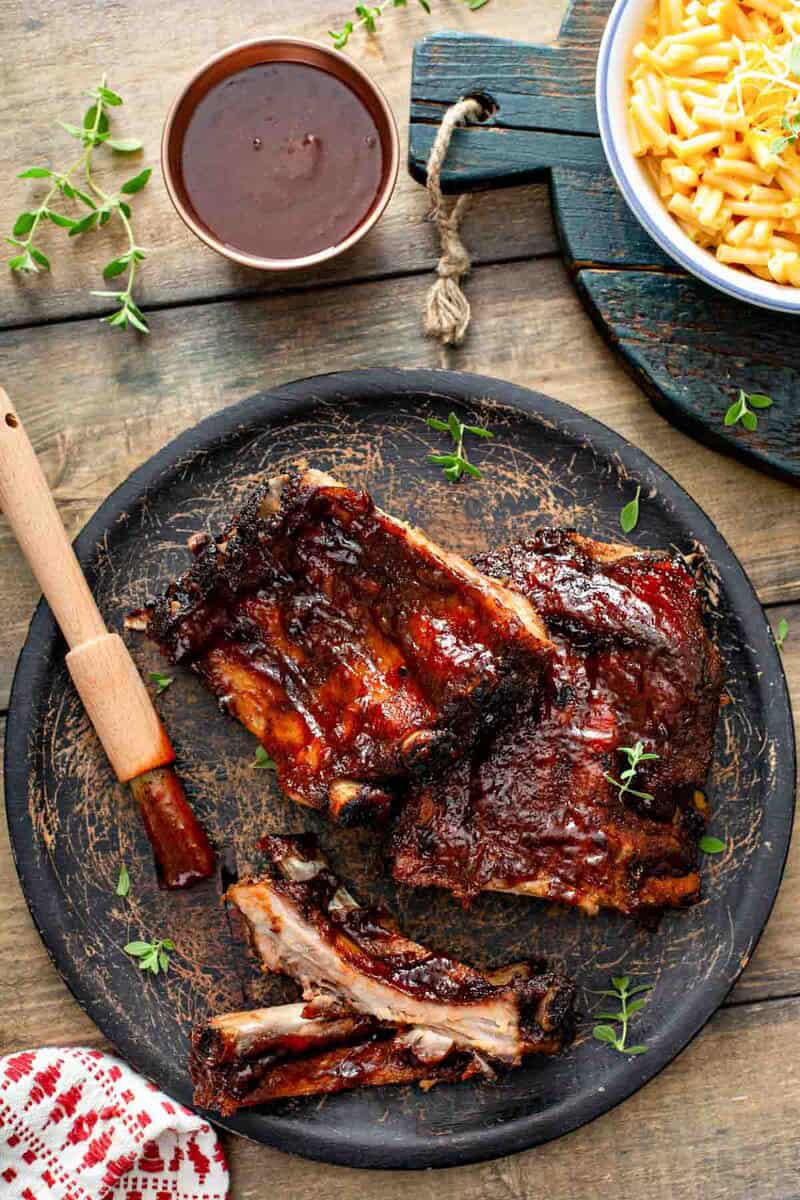 Copycat Claim Jumper bbq baby back ribs, bbq sauce, and mac and cheese.