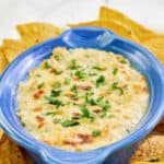 Homemade Joe's crab shack crab dip and tortilla chips on a platter.