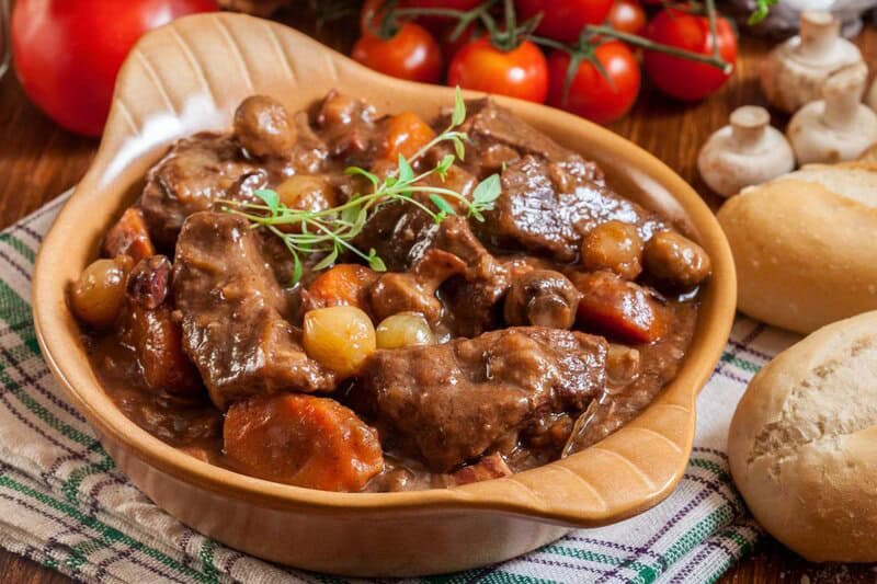 Homemade Julia Child beef bourguignon served with bread.