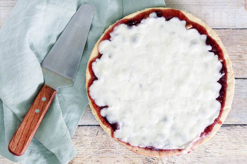 Copycat Marie Callender's sour cream blueberry pie and a pie server.
