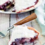Copycat Marie Callender's sour cream blueberry pie and a slice on a plate.