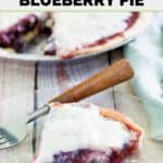Homemade Marie Callender's sour cream blueberry pie and a slice on a plate.