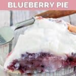 A slice of homemade Marie Callender's sour cream blueberry pie and a fork on a plate.