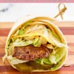 Homemade McDonald's big mac wrap with a decorative pick in it.