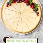 New York style cheesecake sliced and topped with berries.