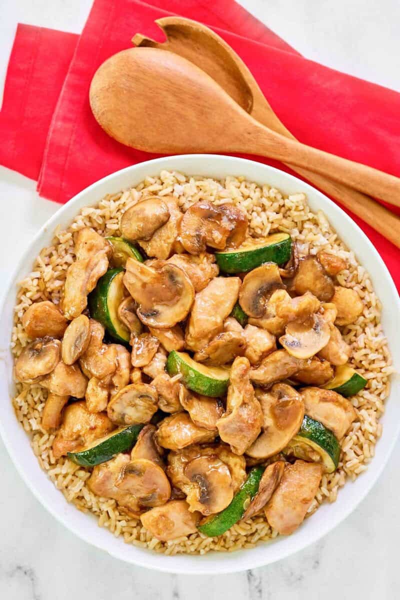 Copycat Panda Express mushroom chicken over rice in bowl.