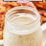 A mason jar filled with homemade Popeyes blackened ranch.