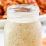 Homemade Popeyes blackened ranch in a glass jar.
