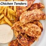 Homemade Popeyes blackened tenders, fries, and a cup of dipping sauce.
