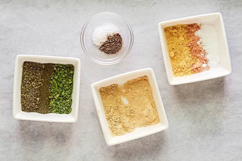 Homemade dry ranch dressing mix ingredients in bowls.