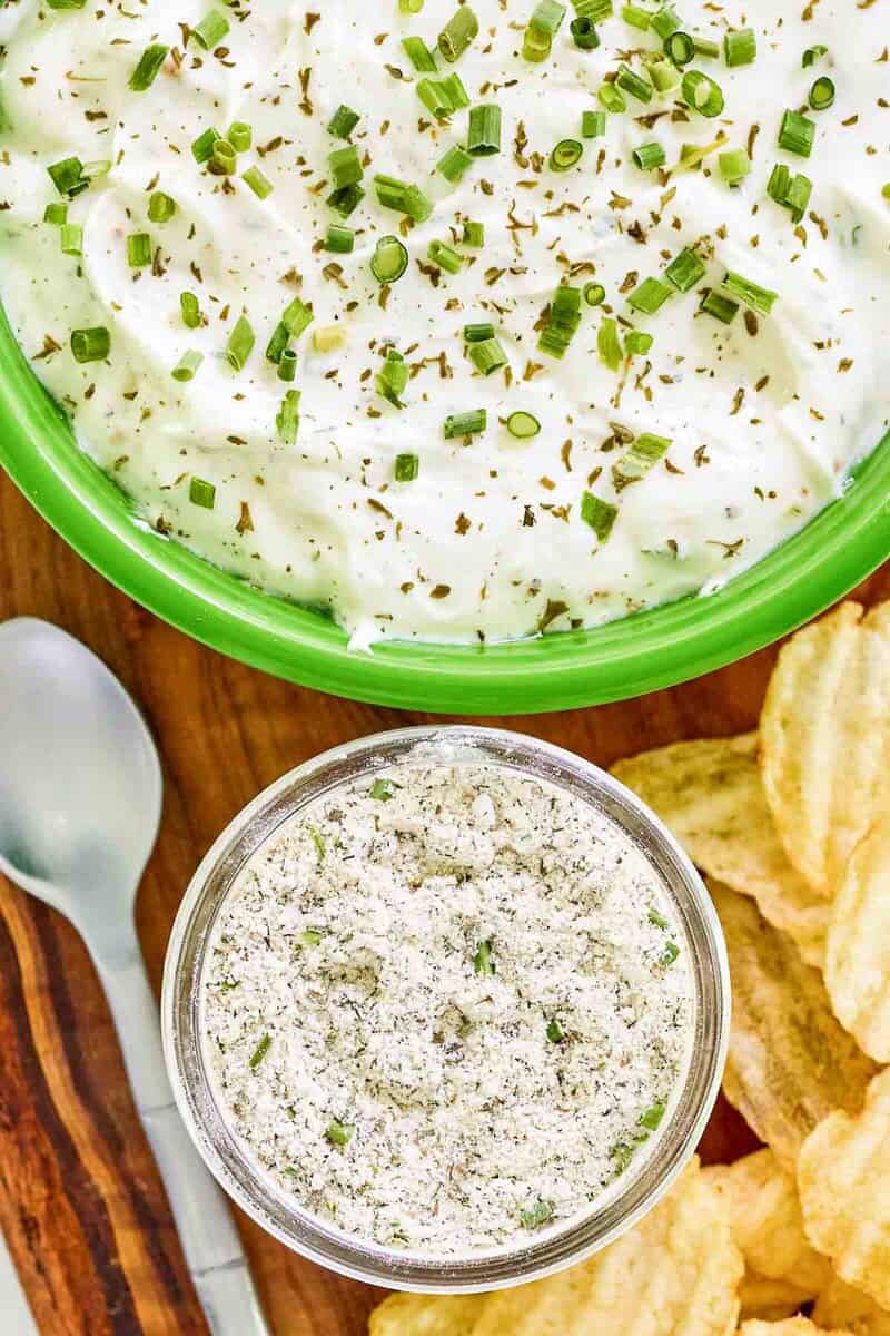 Homemade ranch dressing mix in a jar and ranch dip beside it.