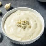 Copycat Simon and Seafort's blue cheese dressing and blue cheese crumbles.