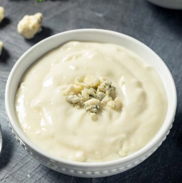 Copycat Simon and Seafort's blue cheese dressing and blue cheese crumbles.