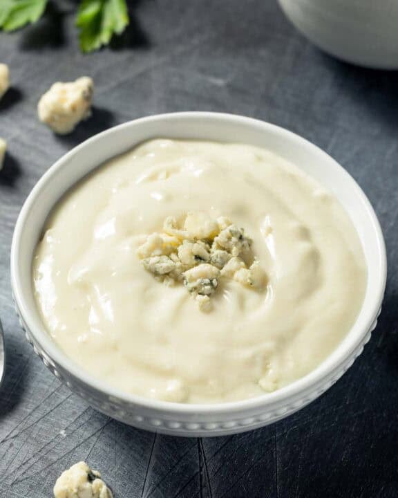 Copycat Simon and Seafort's blue cheese dressing and blue cheese crumbles.