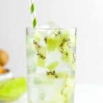 A glass of copycat Starbucks kiwi starfruit refresher drink.